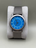 Mentor International blue dial watch front