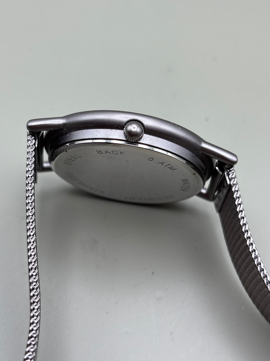 Mentor International watch side view