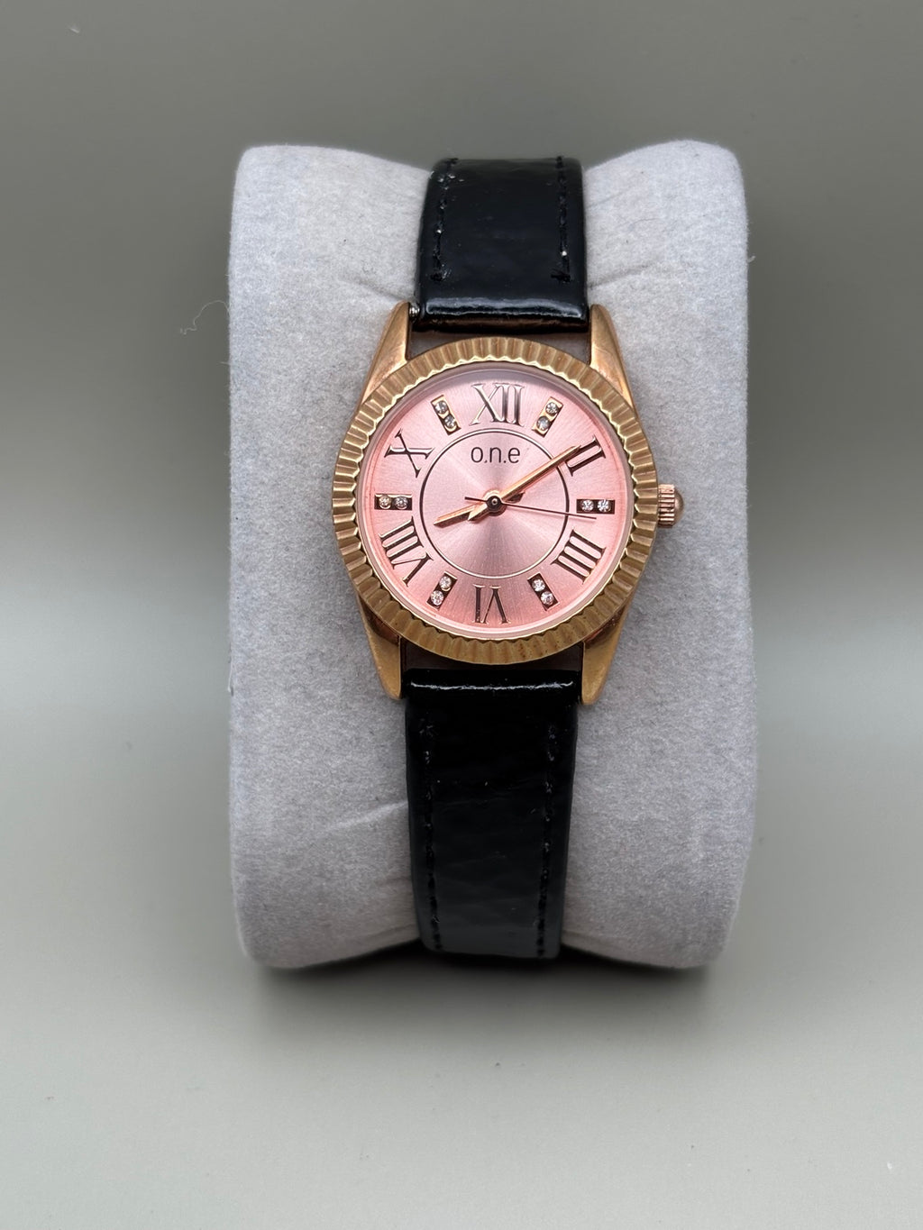 O.N.E rose gold pink dial watch front