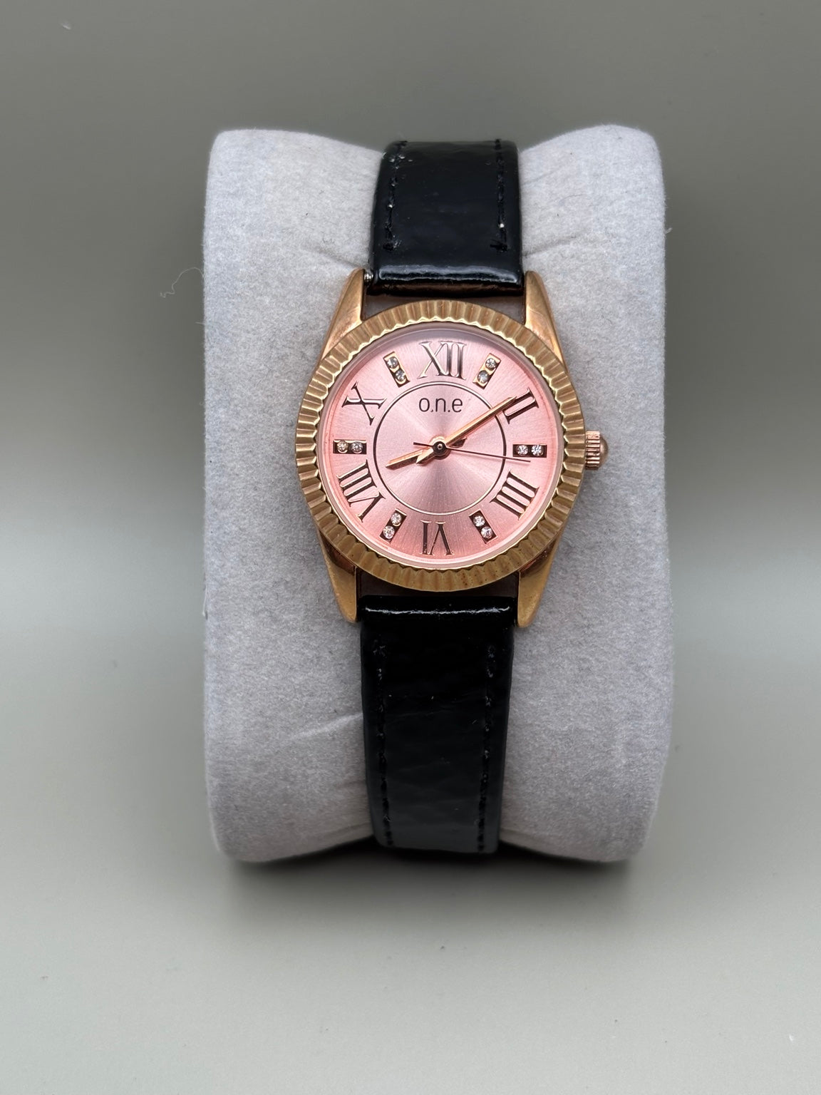 O.N.E rose gold pink dial watch front