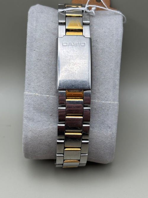 Casio two tone bracelet and signed clasp showing wear