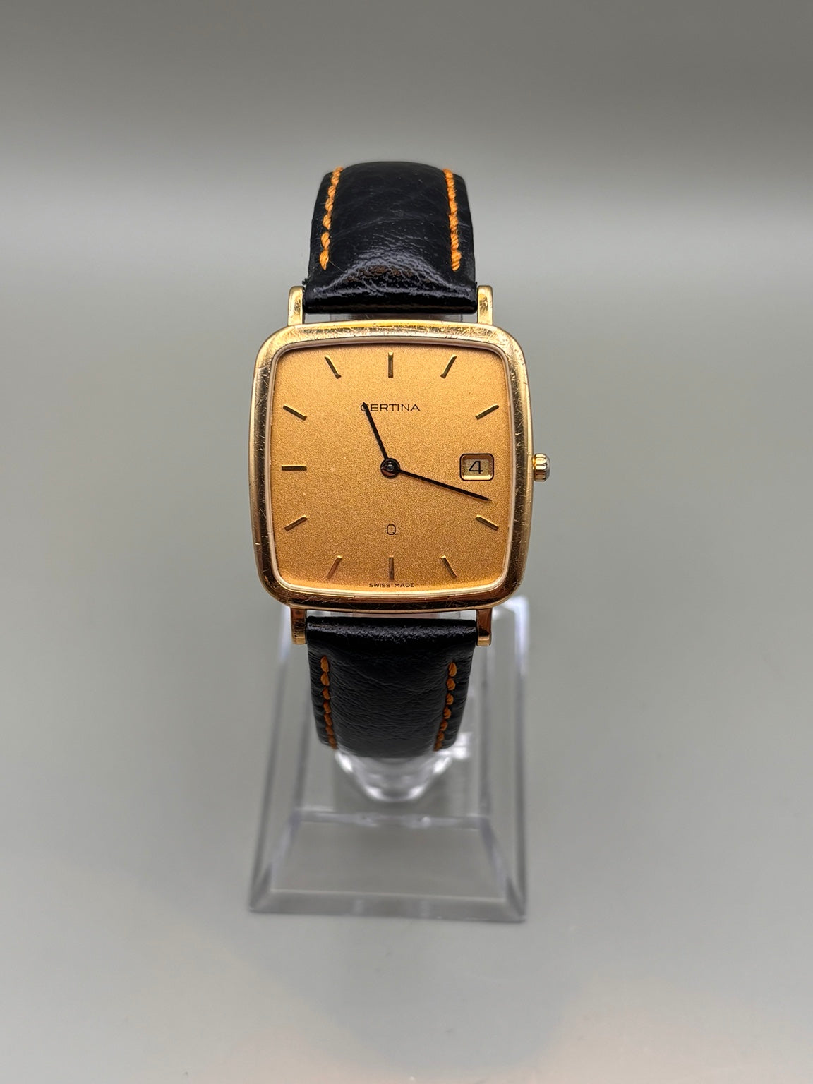 Certina Quartz rectangular gold-tone watch front