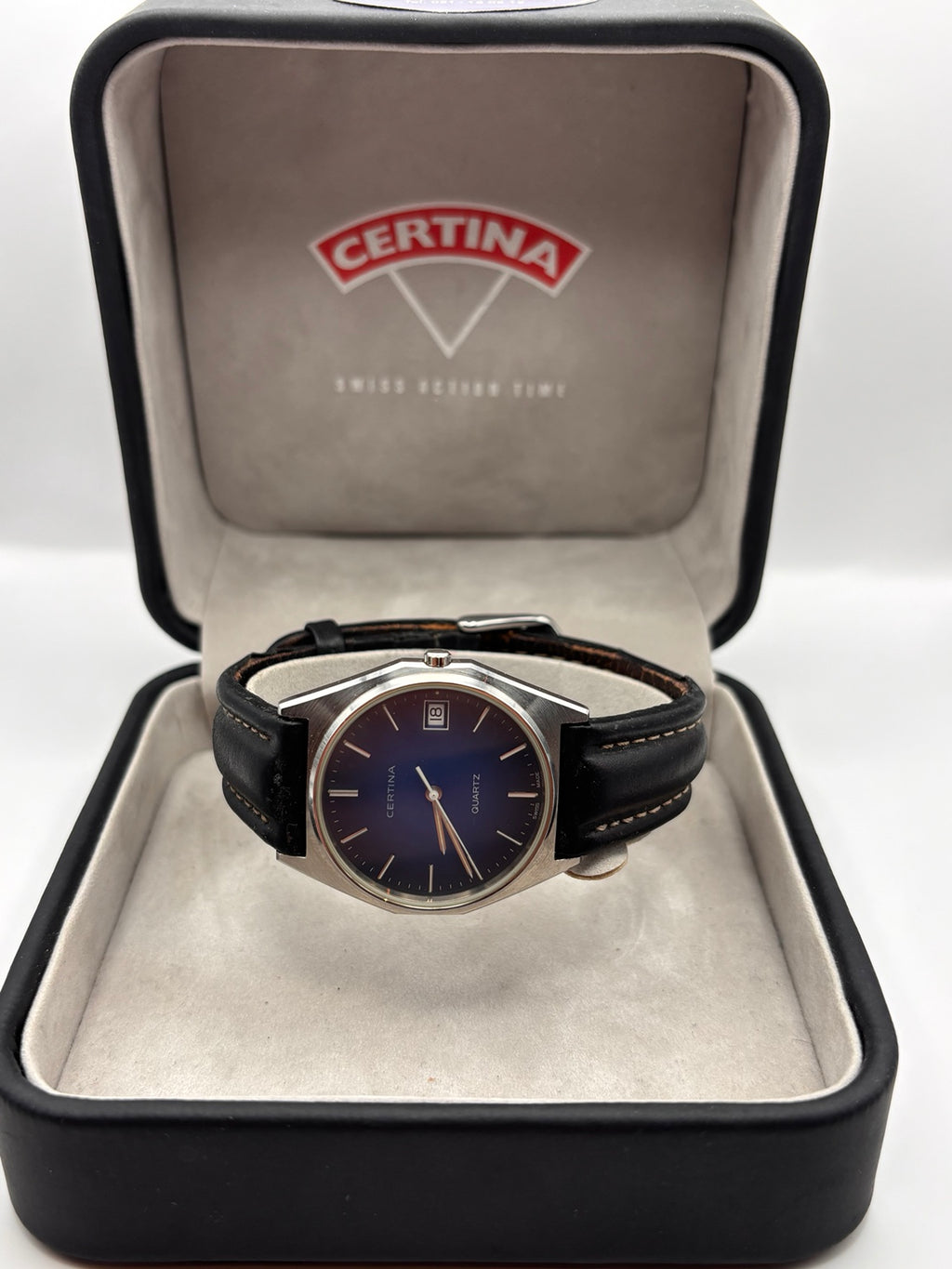 Vintage Certina Swiss quartz blue dial watch displayed in Certina box