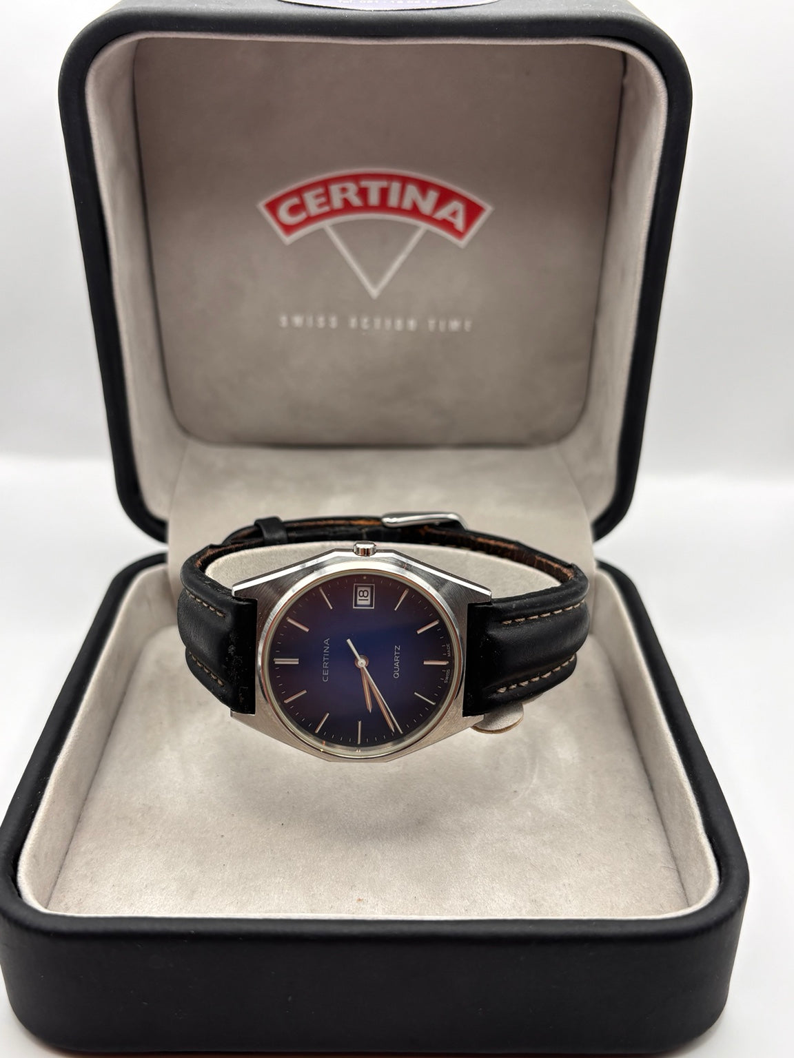 Vintage Certina Swiss quartz blue dial watch displayed in Certina box