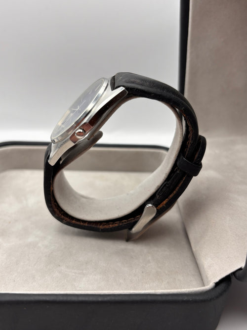 Vintage Certina Swiss quartz watch side view with leather strap