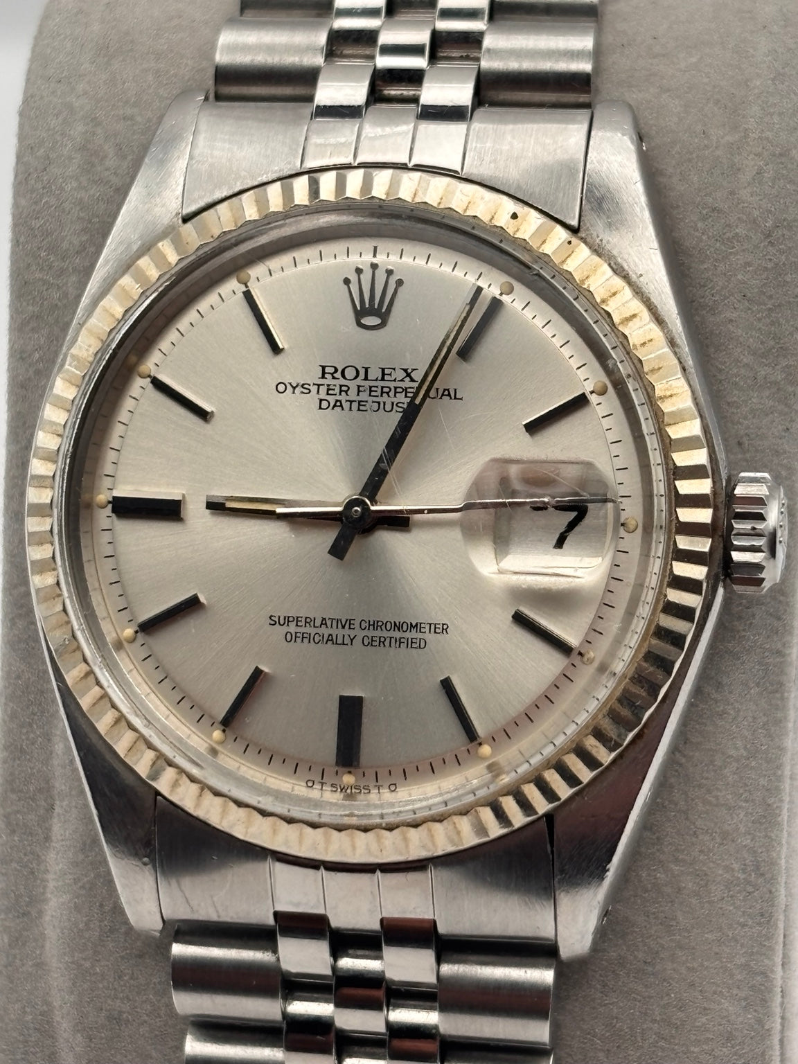 Rolex Datejust 1601 silver dial close-up with date and Cyclops