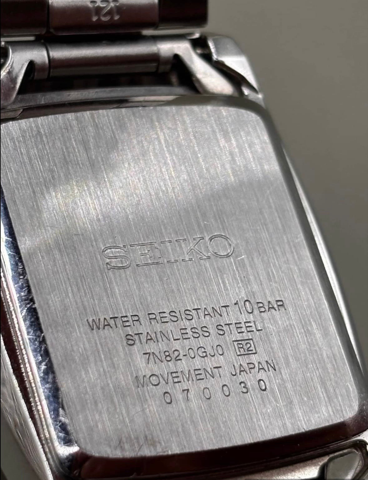 Seiko 7N82-0GJ0 caseback showing reference and 10 bar water resistance
